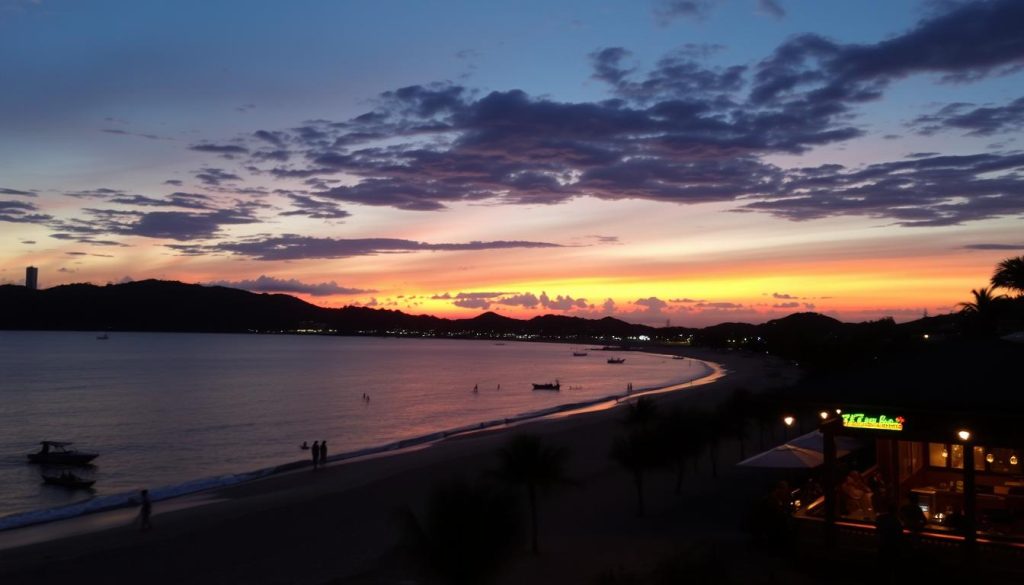 Sunset view of Kata Beach in Phuket with beach bars visible along the shoreline Sunset at Kata Beach